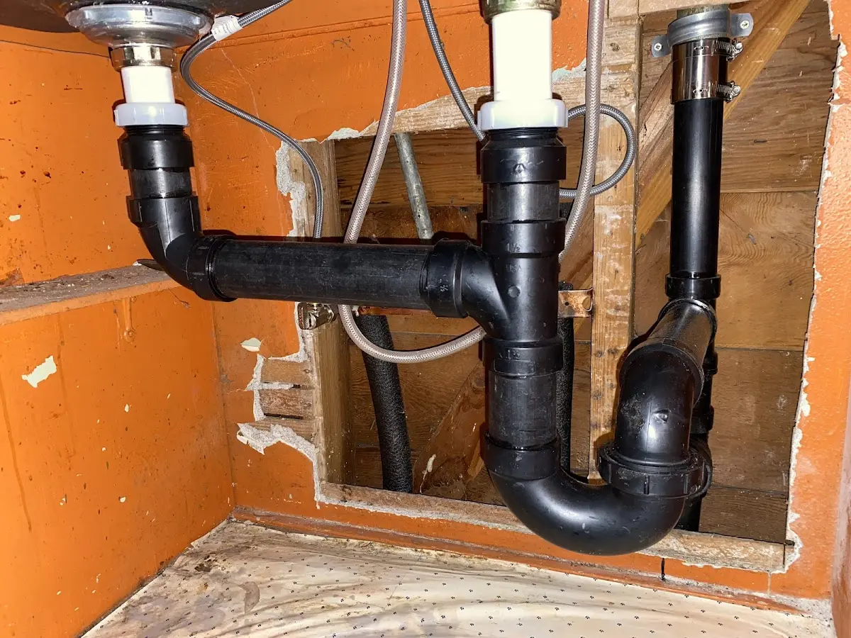Professional Garbage Disposal Repair equipment and tools on the job in Daleville